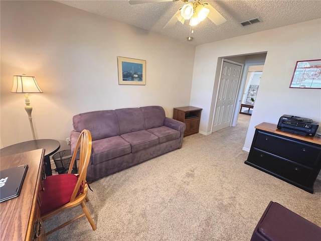 24614 Stillridge Ct, Leesburg, FL 34748 - living room with baseboards, a textured ceiling, a ceiling fan, carpet floors, and visible vents