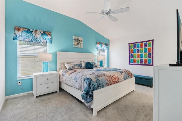 bedroom featuring baseboards, lofted ceiling, light colored carpet, and ceiling fan