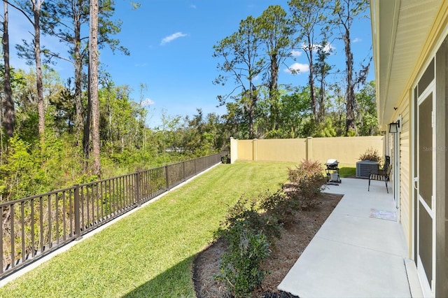 view of yard with a patio area and a fenced backyard