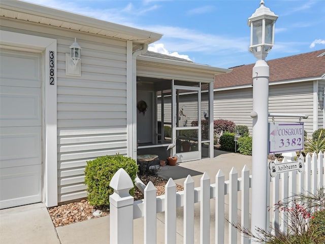 property entrance featuring fence