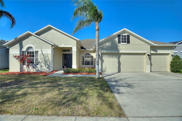 single story home with stucco siding, driveway, a front yard, and an attached garage