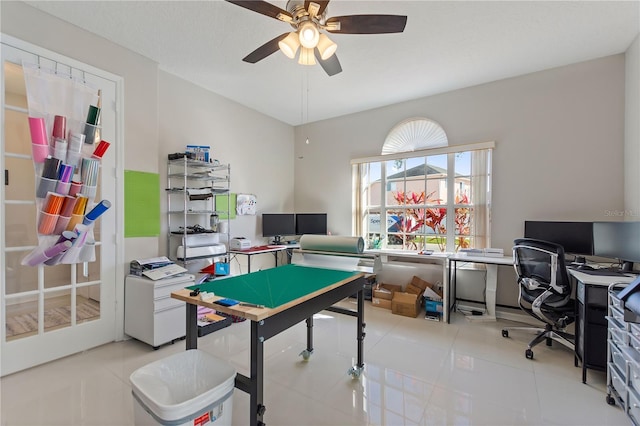 rec room featuring light tile patterned flooring and a ceiling fan