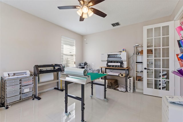 tiled home office with visible vents and ceiling fan