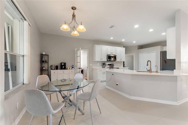 dining room with recessed lighting, visible vents, baseboards, and a notable chandelier