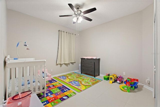 bedroom featuring baseboards and a ceiling fan