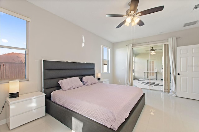 tiled bedroom featuring visible vents and ceiling fan