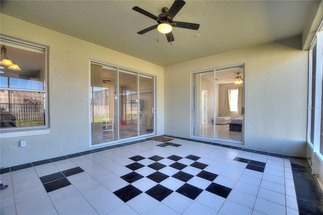 view of patio / terrace featuring ceiling fan