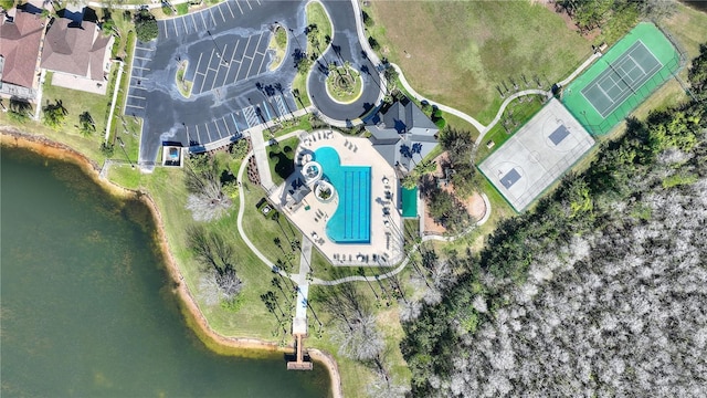 birds eye view of property with a water view