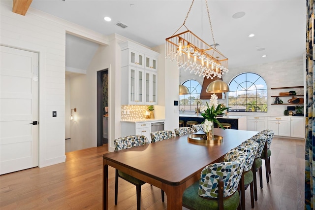 dining room featuring recessed lighting, visible vents, and wood finished floors