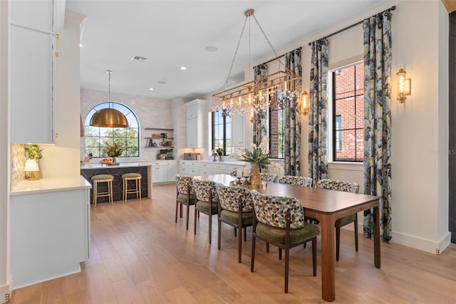 dining area with visible vents, recessed lighting, baseboards, and light wood-style floors