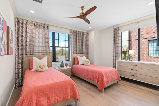 bedroom featuring recessed lighting, wood finished floors, and a ceiling fan