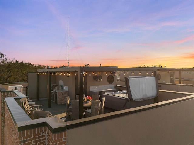 view of patio featuring exterior kitchen