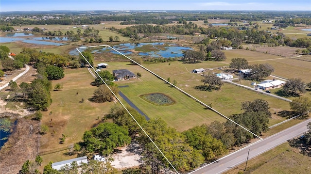 bird's eye view featuring a water view and a rural view