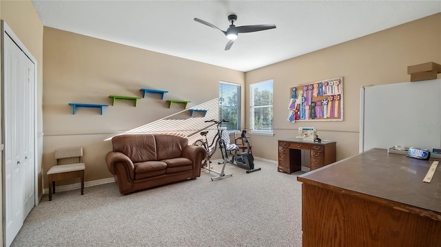 carpeted bedroom with a closet, a ceiling fan, and baseboards