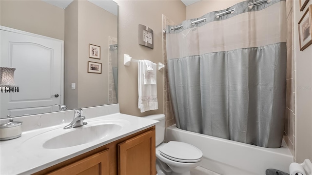 full bath featuring vanity, shower / tub combo, and toilet