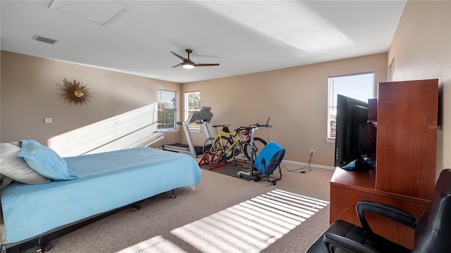 bedroom featuring visible vents, carpet floors, baseboards, and ceiling fan