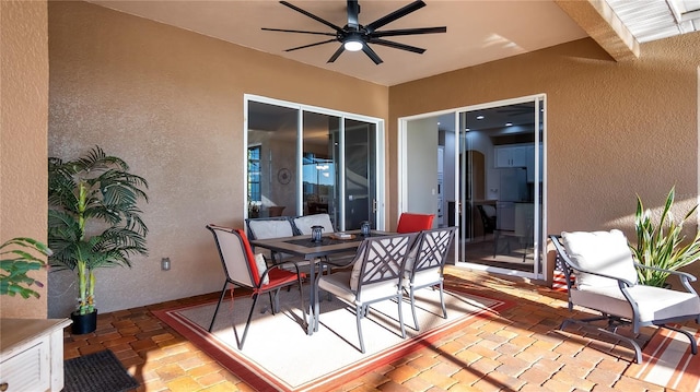 deck with a patio area, outdoor dining area, and a ceiling fan