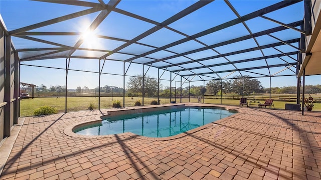 outdoor pool with a lanai and a patio