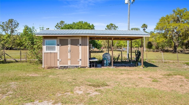 view of shed with fence