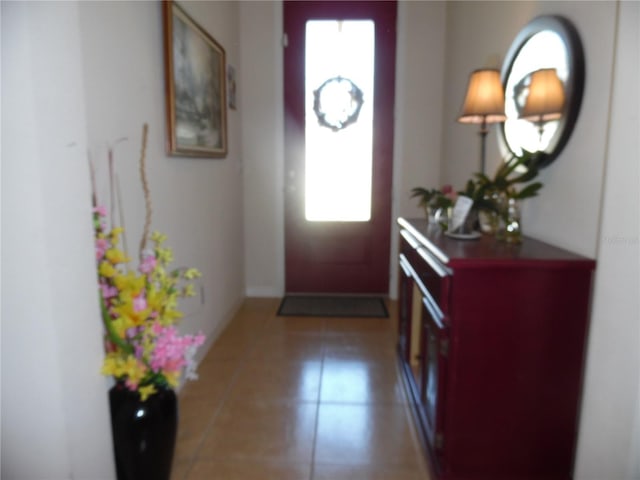 entryway with light tile patterned floors