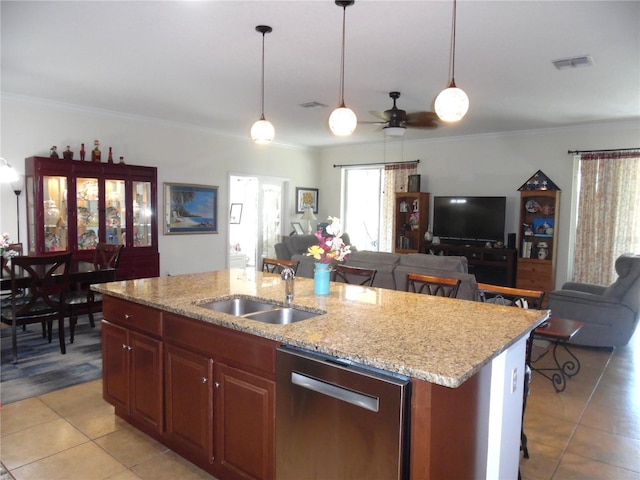 kitchen with open floor plan, a center island with sink, dishwasher, hanging light fixtures, and a sink