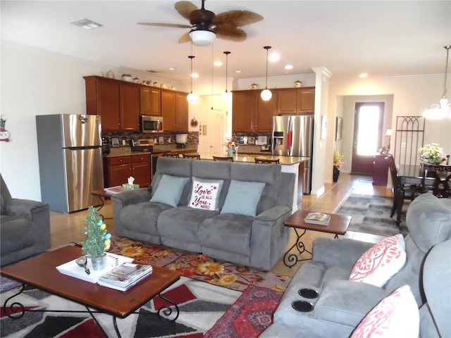 living room with visible vents, ornamental molding, ceiling fan with notable chandelier, recessed lighting, and light tile patterned floors