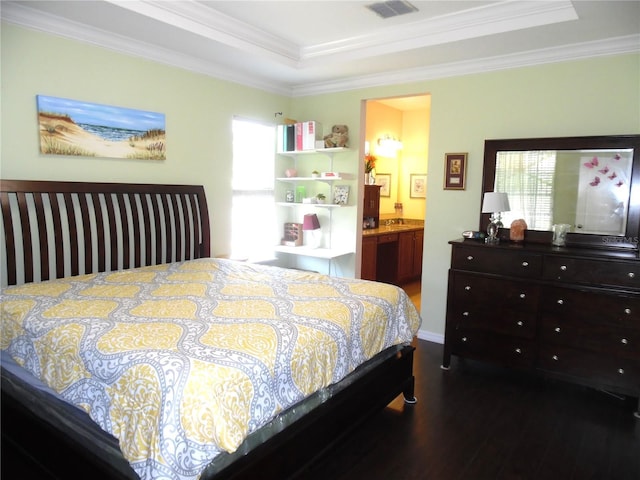 bedroom featuring multiple windows, dark wood-style floors, visible vents, and ornamental molding