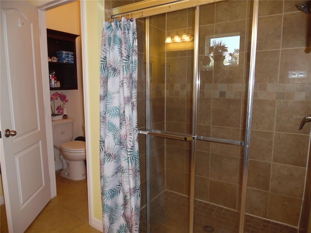 full bathroom with toilet, a shower stall, and tile patterned flooring