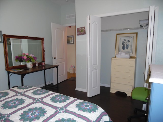 bedroom featuring dark wood-type flooring and visible vents