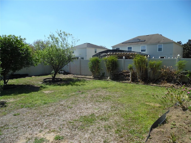 view of yard featuring a fenced backyard and a pergola