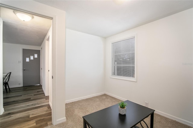 interior space featuring baseboards