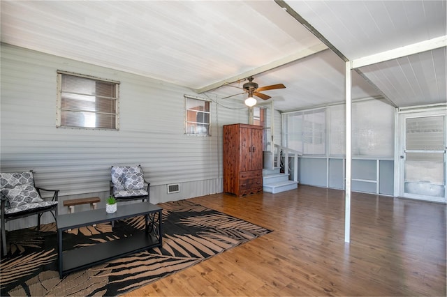 sunroom / solarium with beam ceiling, visible vents, and ceiling fan