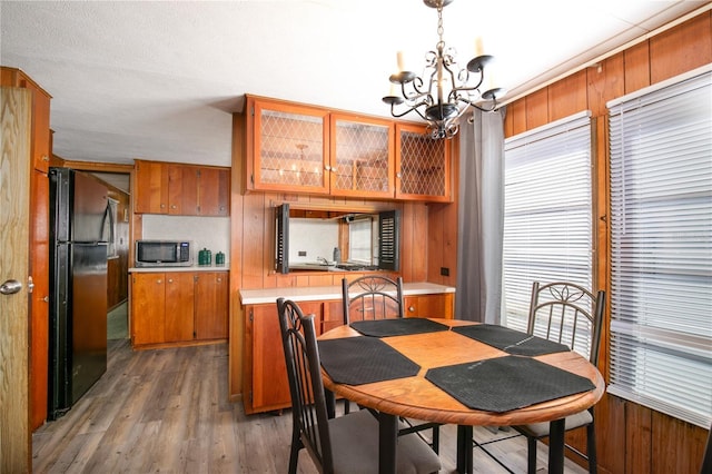 dining room with an inviting chandelier and wood finished floors