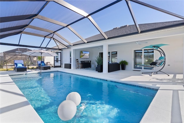 outdoor pool featuring an outdoor living space, a patio, a lanai, and a ceiling fan