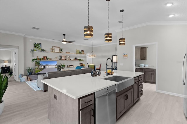 kitchen featuring visible vents, a sink, stainless steel dishwasher, light countertops, and ceiling fan