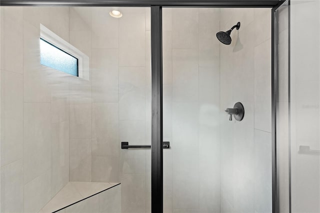 bathroom with a shower stall