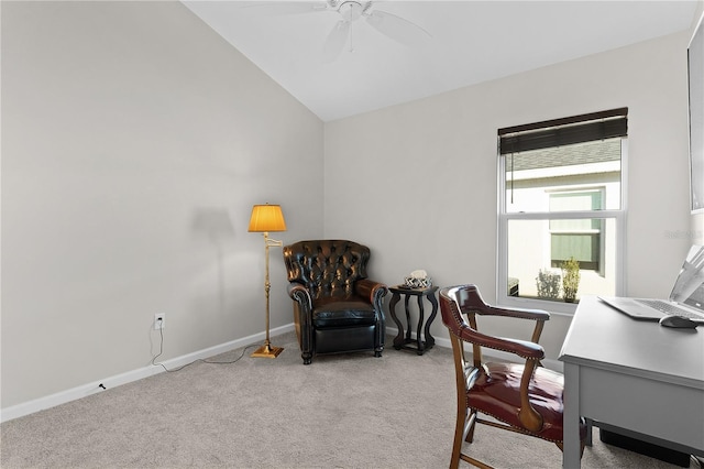 carpeted office space with baseboards, lofted ceiling, and a ceiling fan