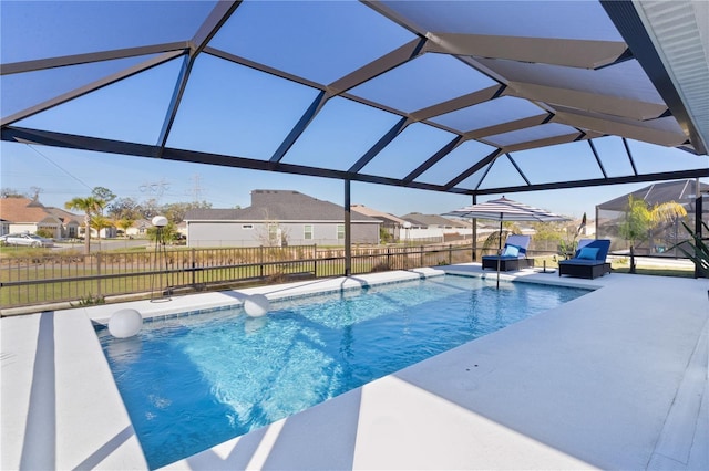 view of swimming pool with a patio area, a residential view, a fenced in pool, and fence