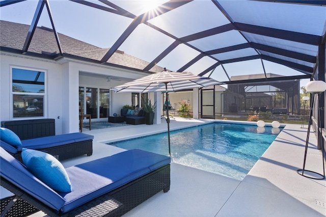 pool featuring a lanai, ceiling fan, outdoor lounge area, and a patio area