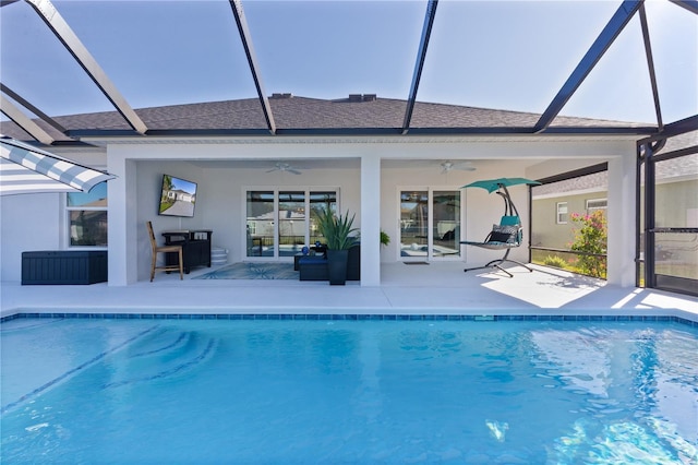 pool featuring ceiling fan, a patio, and a lanai