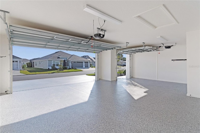 garage featuring a residential view and a garage door opener