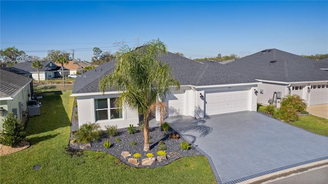 view of front of property featuring stucco siding, an attached garage, a shingled roof, and driveway