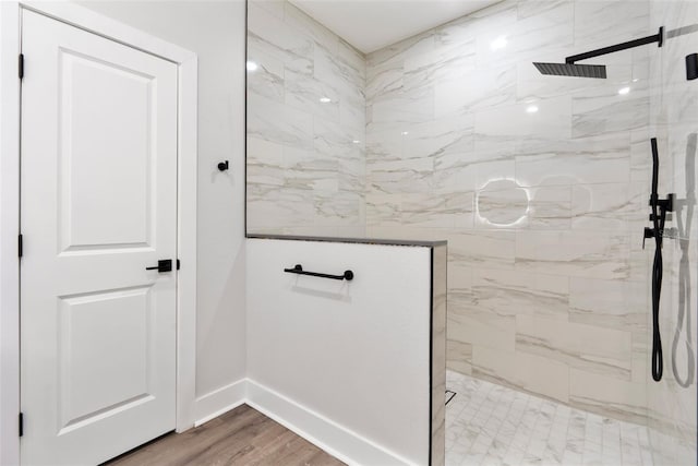 12871 SW 85th Pl, Dunnellon, FL 34432 - bathroom with baseboards, a marble finish shower, and wood finished floors