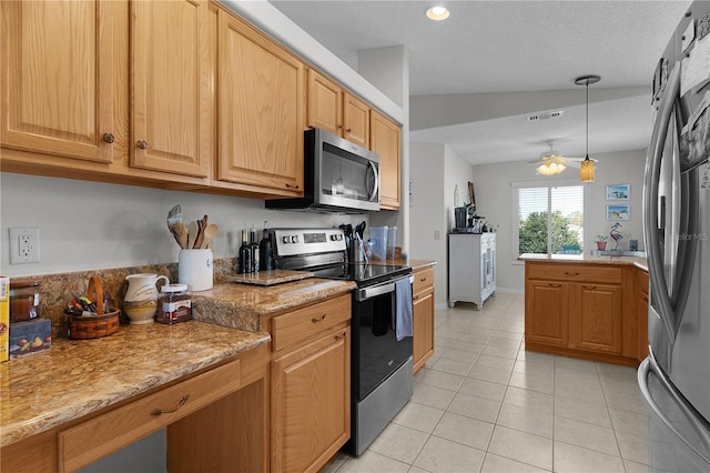 kitchen with visible vents, hanging light fixtures, light tile patterned flooring, stainless steel appliances, and a ceiling fan