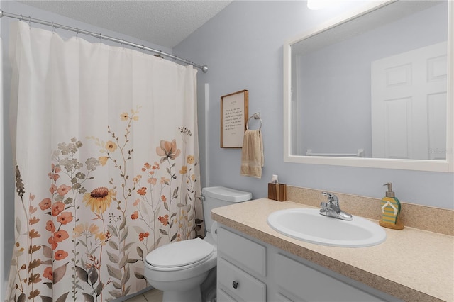 bathroom with toilet, curtained shower, a textured ceiling, and vanity