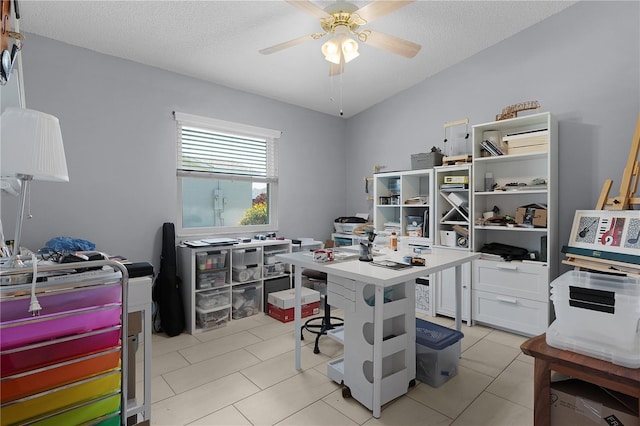 office area featuring light tile patterned floors, a textured ceiling, and a ceiling fan