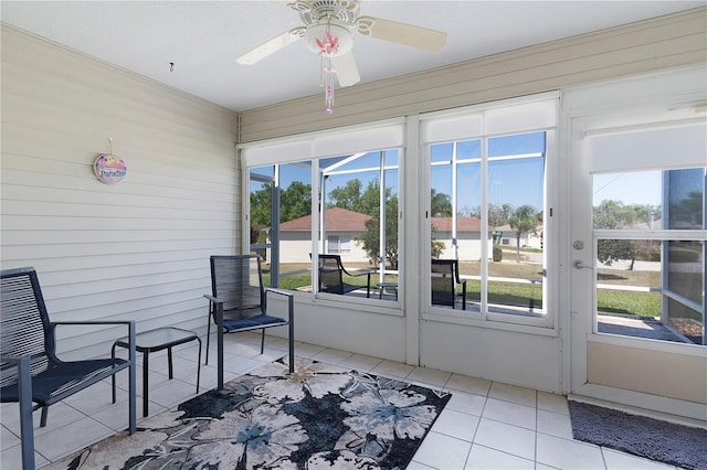 sunroom / solarium with plenty of natural light and ceiling fan