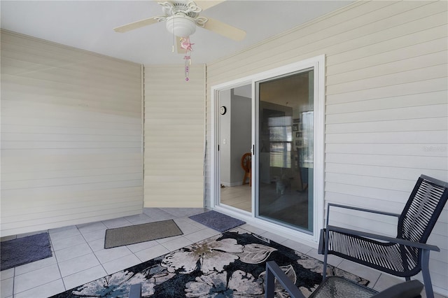 doorway to property with a ceiling fan and a patio area