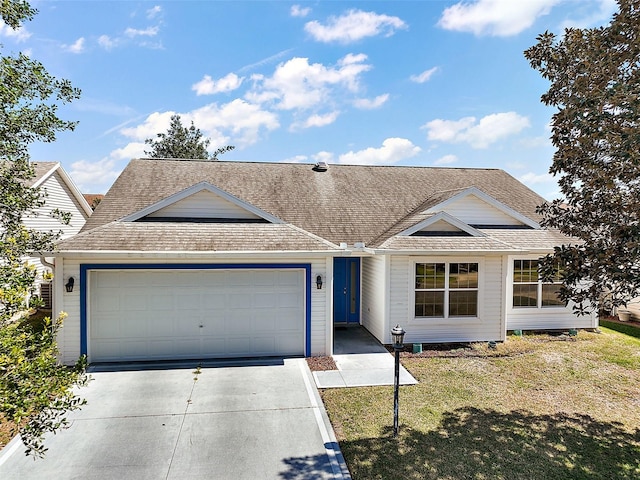 ranch-style house featuring an attached garage, concrete driveway, and a shingled roof