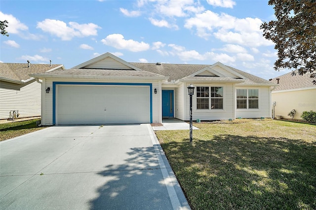 ranch-style home with an attached garage, concrete driveway, and a front yard